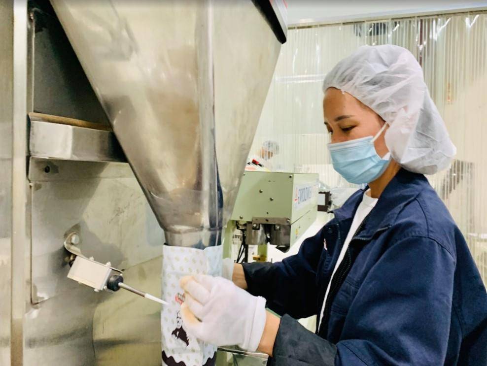 A woman working on a production line of the Suzhou factory